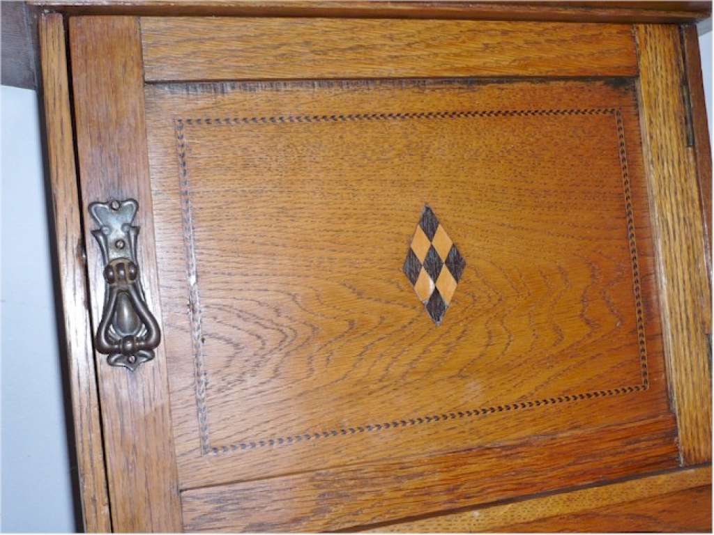 Arts and crafts hanging wall cupboard in golden oak
