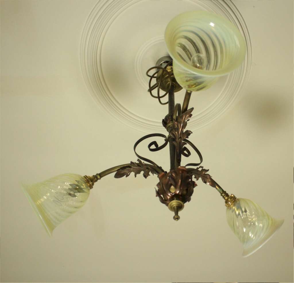 Arts and crafts three branch ceiling light in iron and copper