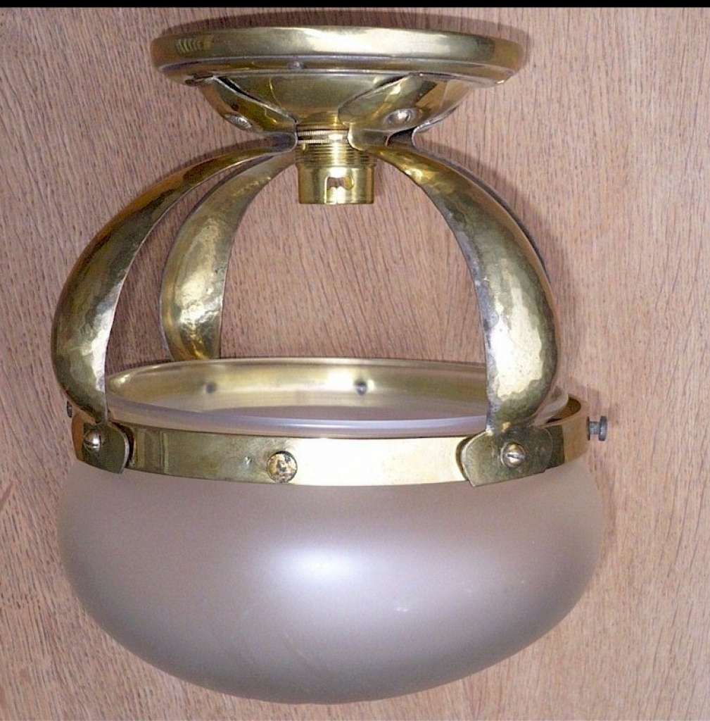 Small domed ceiling light in hammered brass