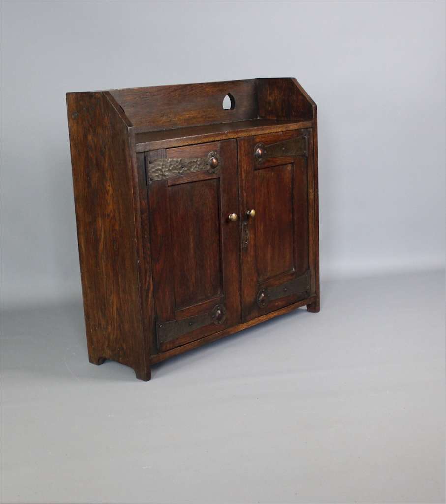 Arts and Crafts oak wall cabinet. c1900