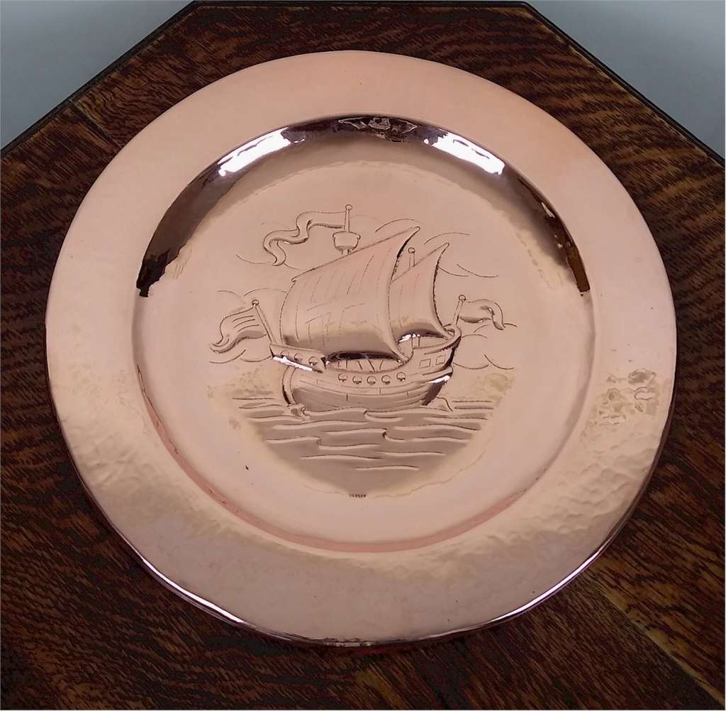 Newlyn arts and crafts charger in hammered copper