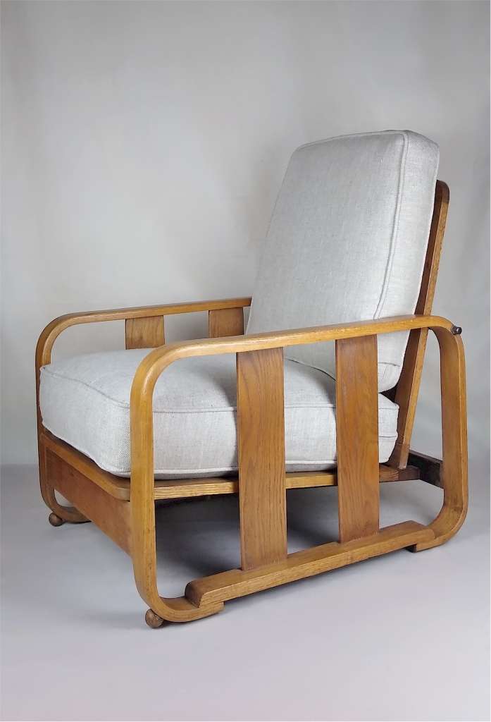 Pair of Heals adjustable armchairs in pale oak