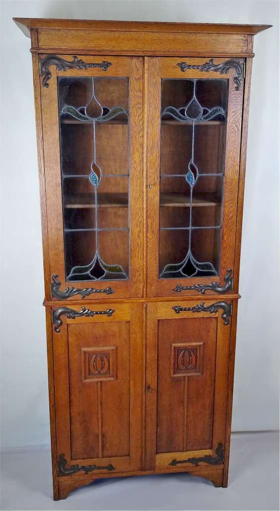 Arts and crafts bookcase with coloured leaded glass