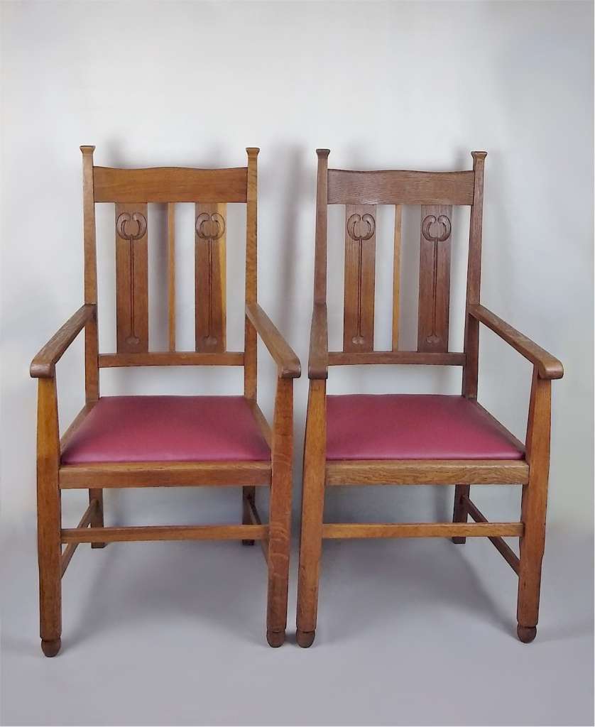 Pr of Liberty & Co armchairs in oak