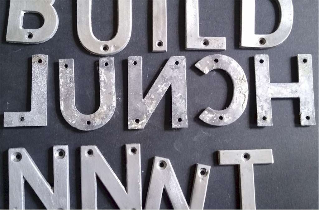 Collection of small aluminium letters