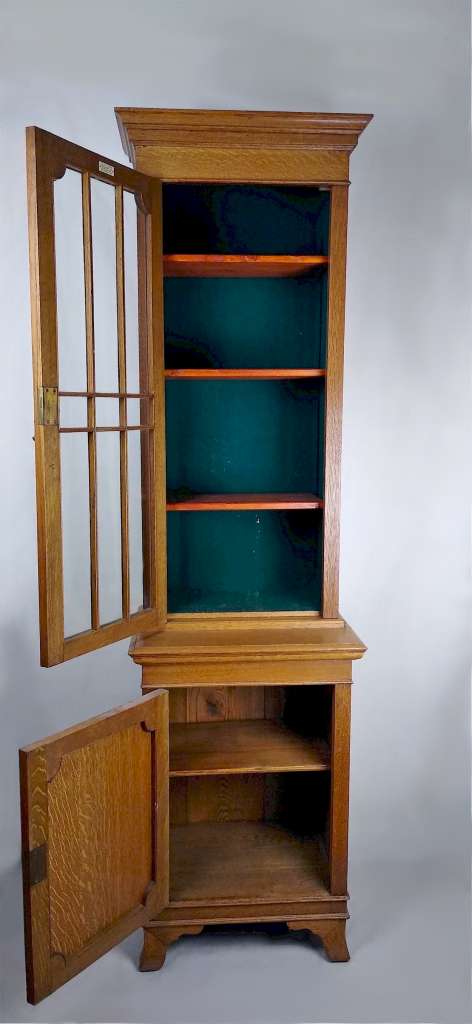 Narrow and tall arts and crafts bookcase in golden oak