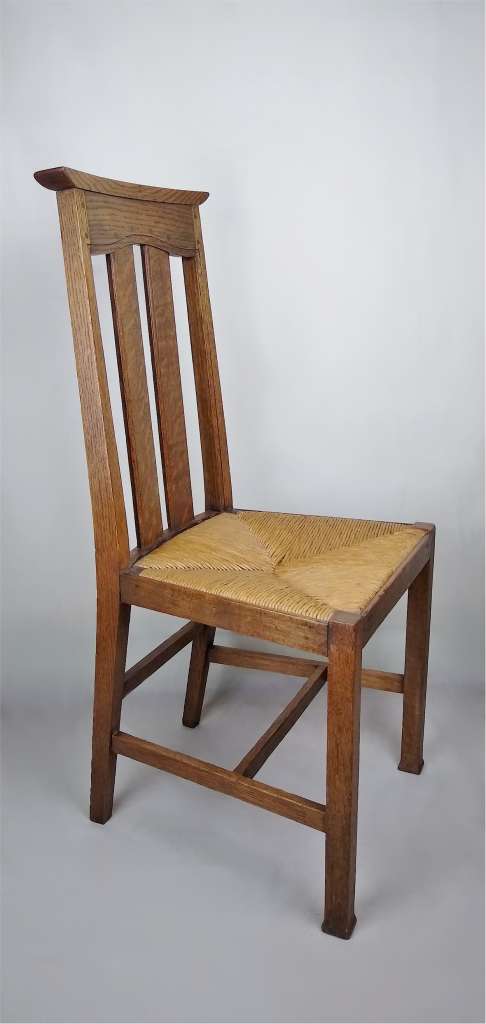 Arts and crafts oak dining chairs by Liberty