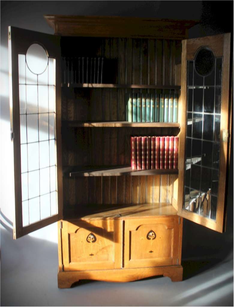 Arts and Crafts oak pewter inlaid bookcase