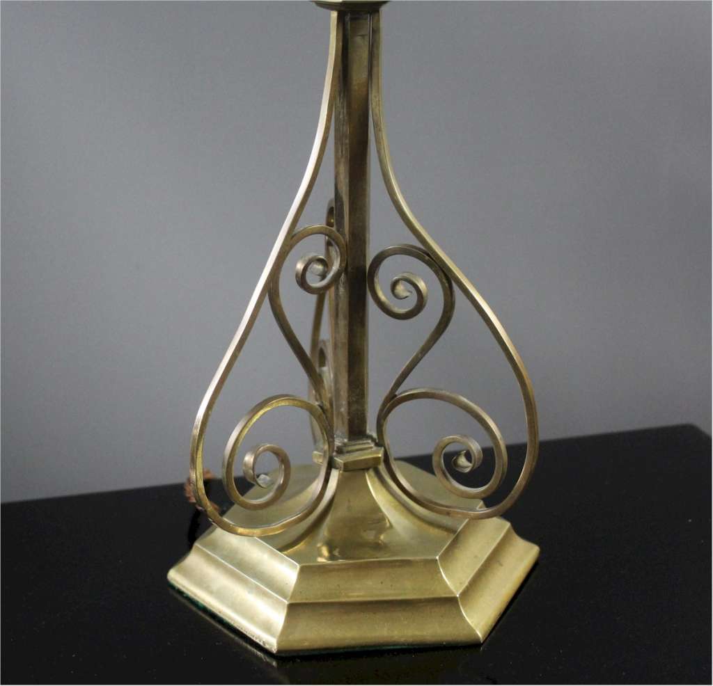 Edwardian brass table lamp with scroll supports