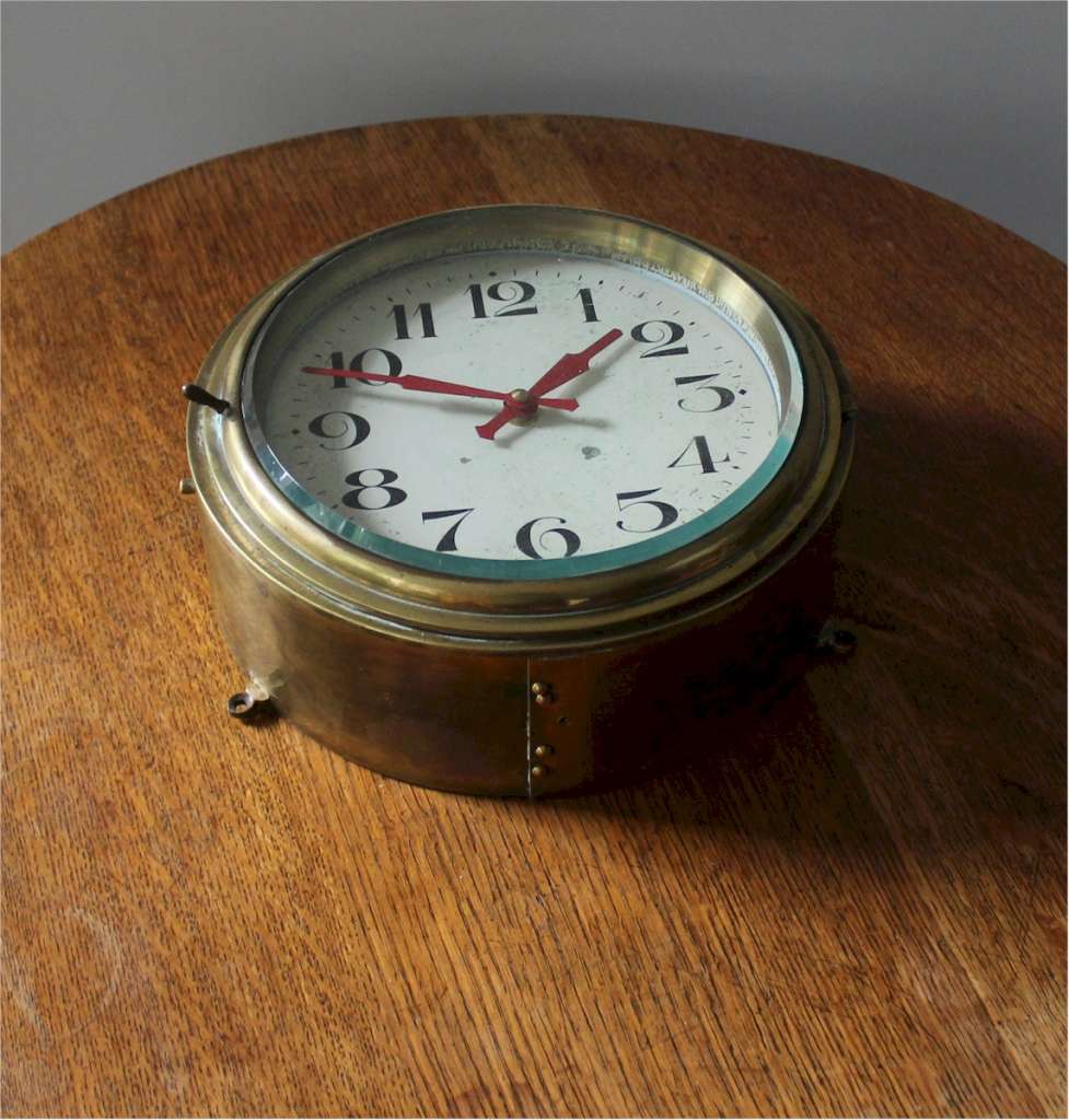 Antique brass Ships clock with  Arabic numerals