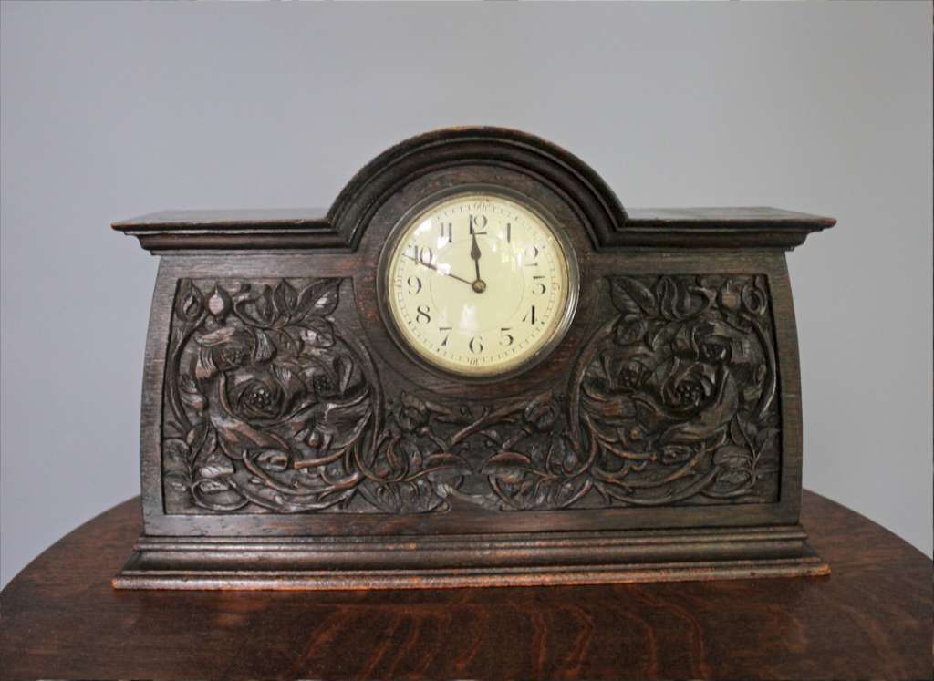 Arts and crafts carved oak mantle clock