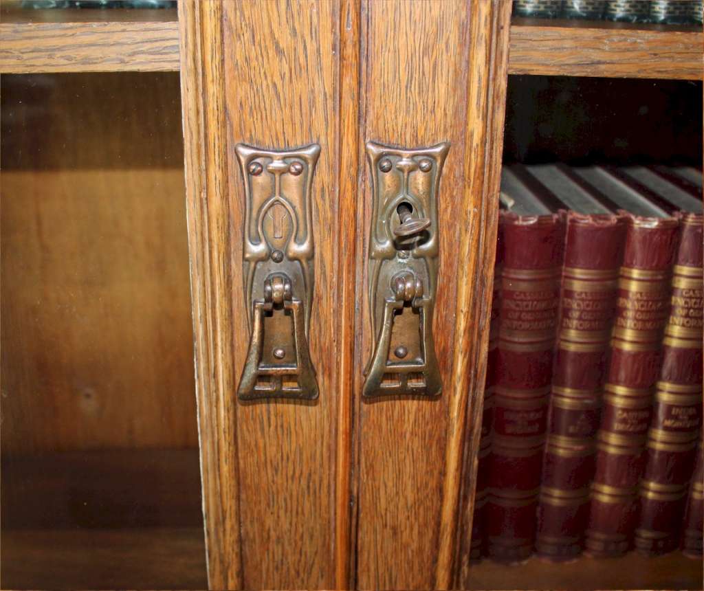 Arts and crafts copper strap oak bookcase