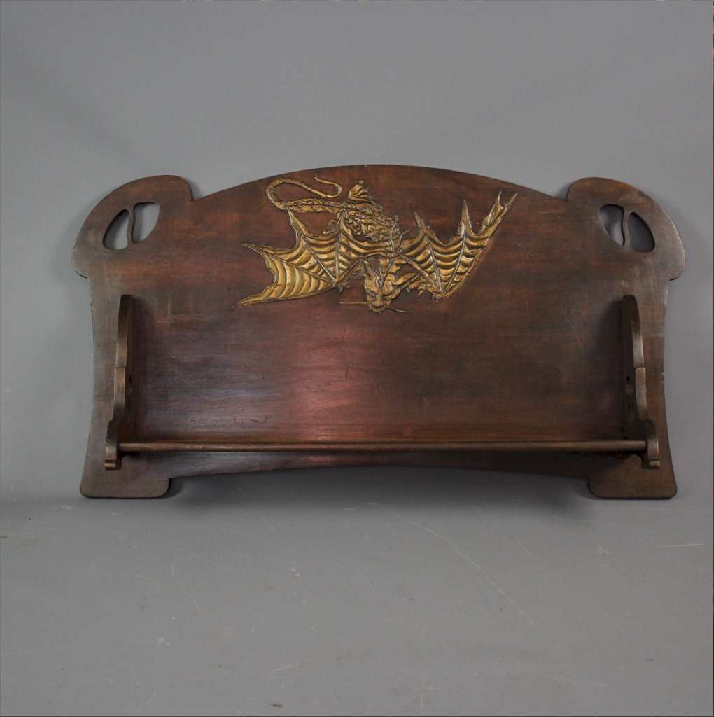 Arts and Crafts wall shelf with dragon