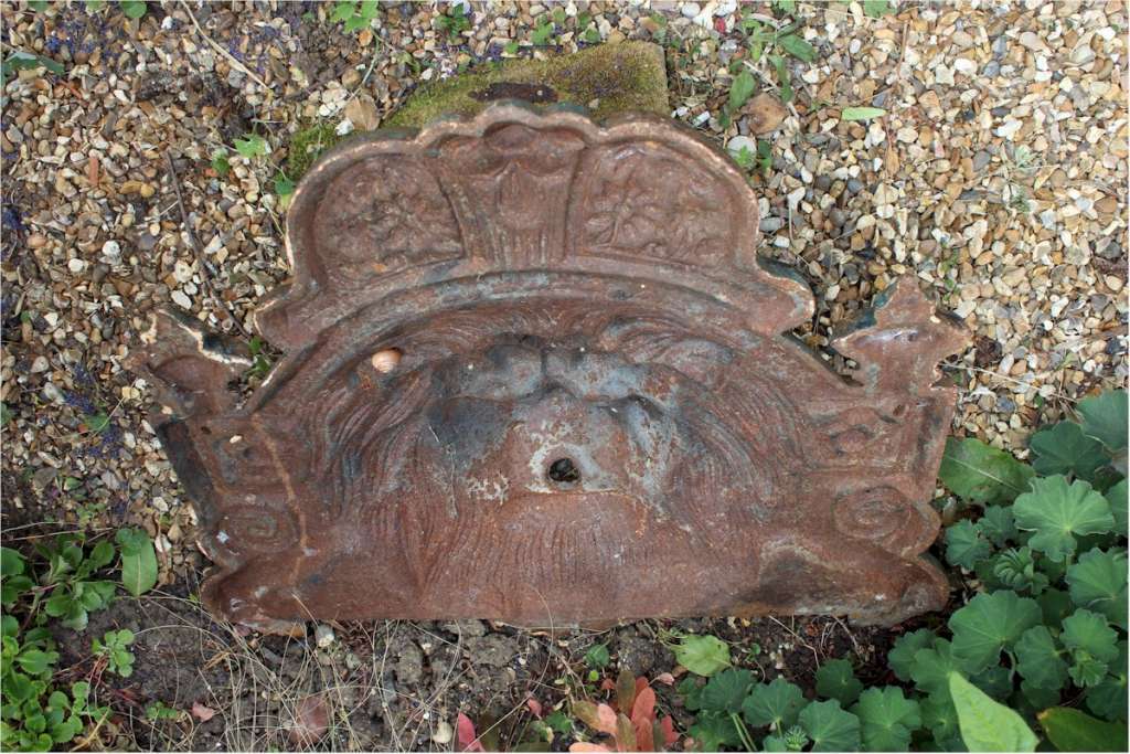 antique cast Iron Lions fountain head.