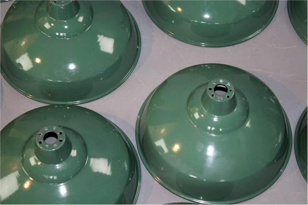 Quantity of original green enamelled industrial shades.