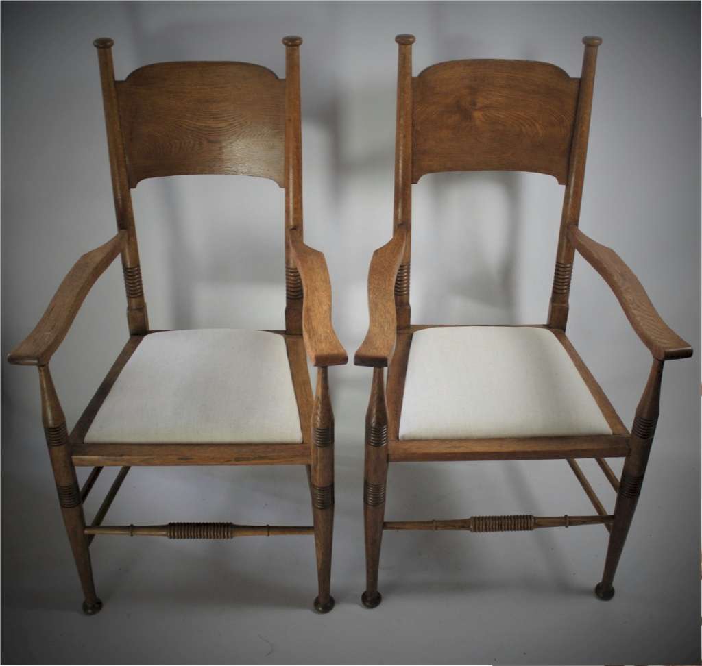 Pair of arts and crafts oak carver chairs by William Birch