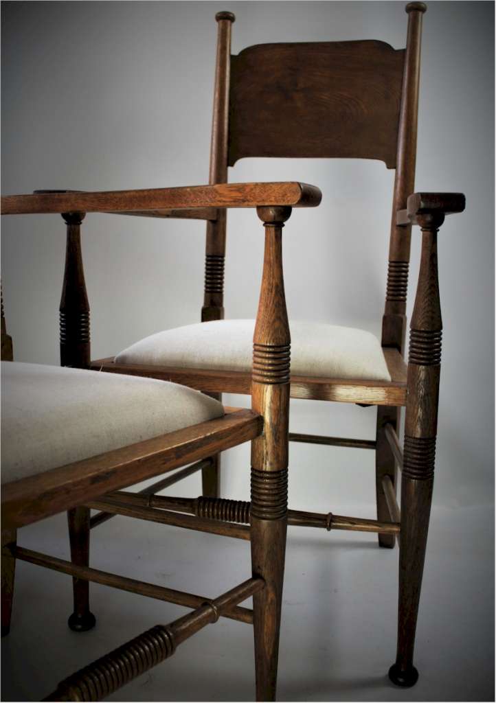 Pair of arts and crafts oak carver chairs by William Birch