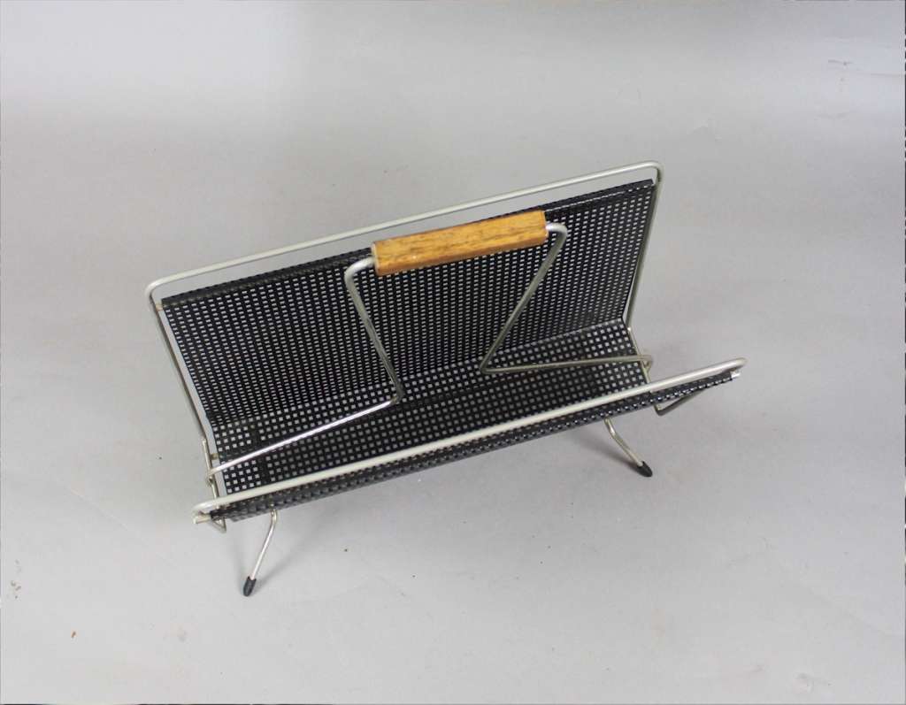 Perforated magazine rack from the 1950's