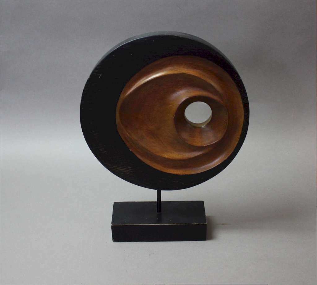 Mid century sculpture in wood on stand.