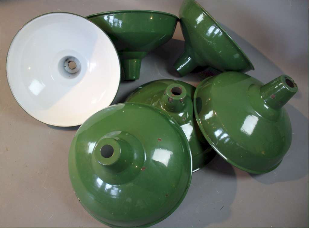 Six green enamelled factory shades