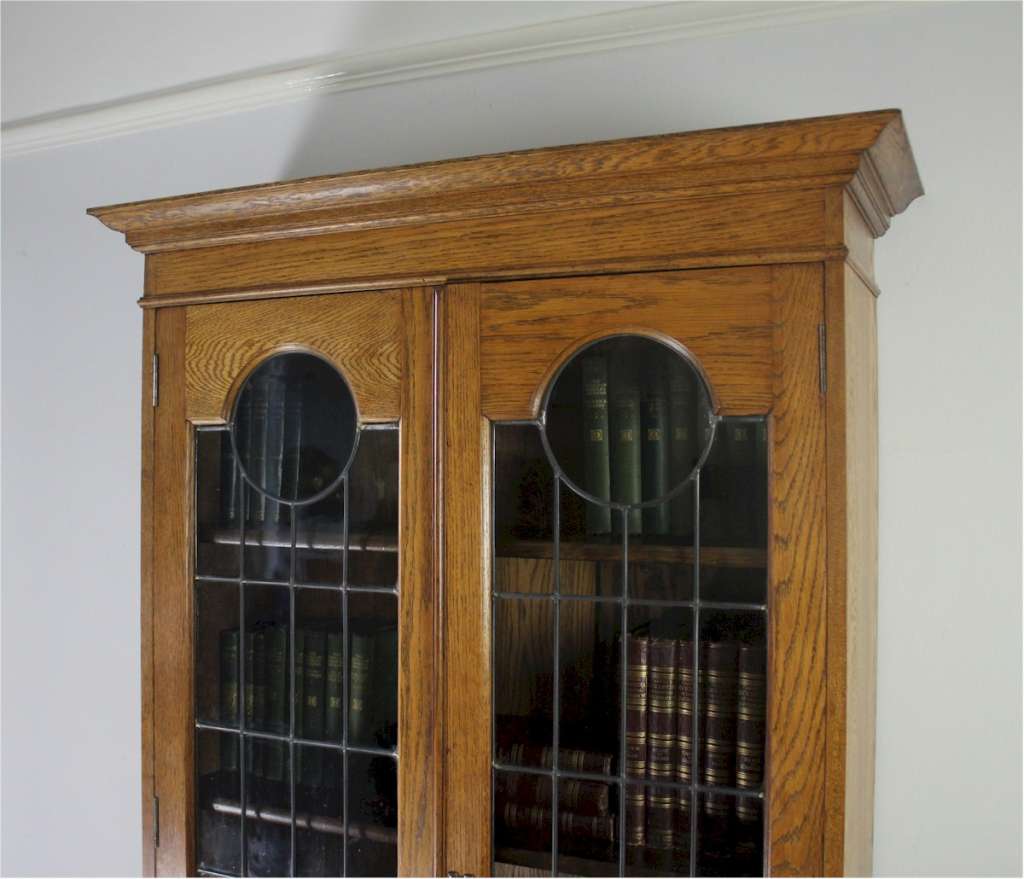 Arts and crafts oak glazed bookcase pewter and ebony inlay
