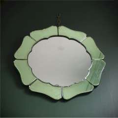 An Art Deco green mirror