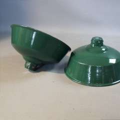 Two green enamelled industrial shades.