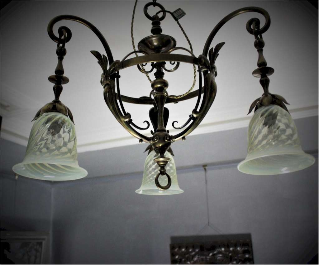 Arts and crafts brass hanging lamp with vaseline shades.
