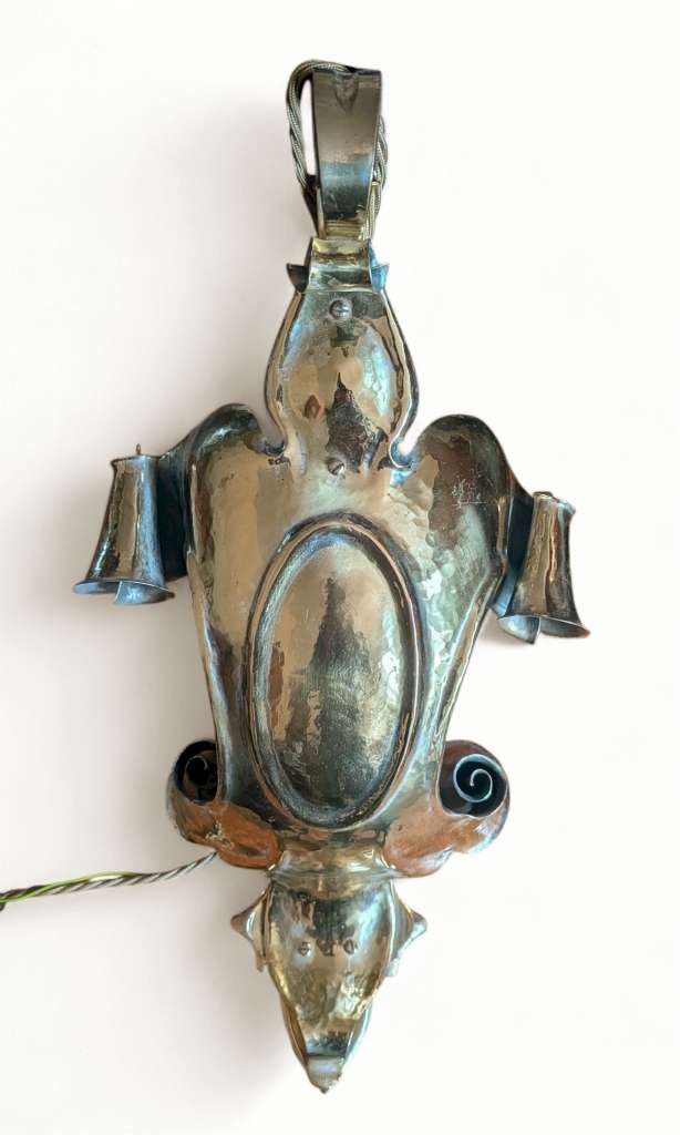 Spectacular arts and crafts wall light in hammered brass