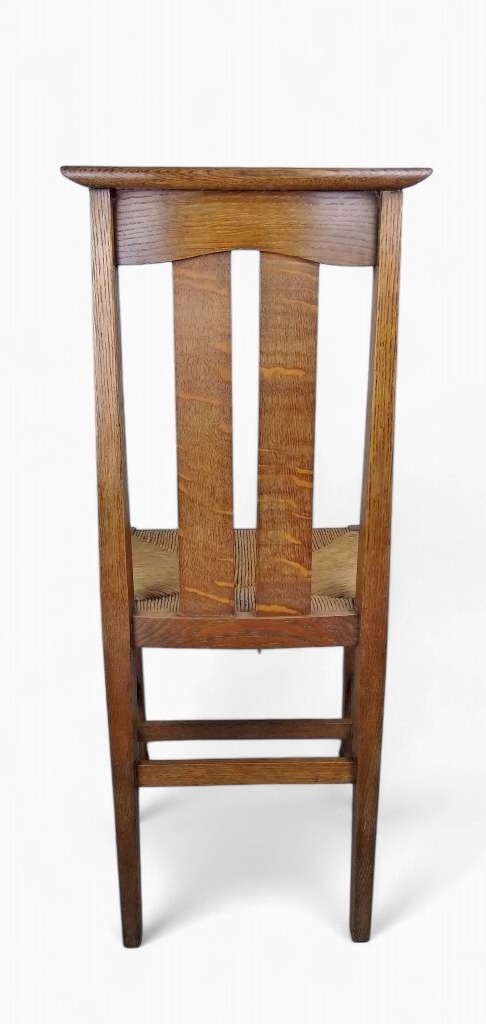 Arts and crafts oak dining chairs by Liberty