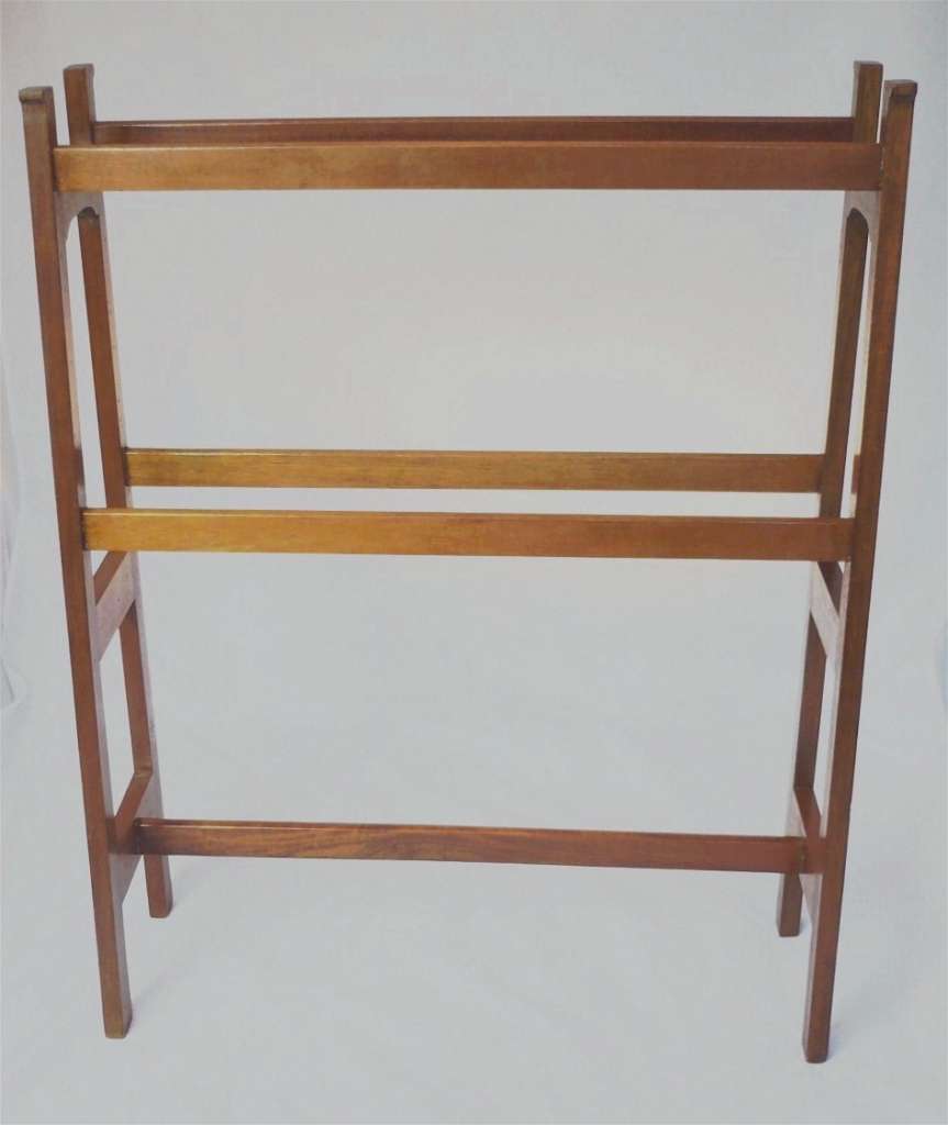 Arts and crafts towel rail of tapered construction