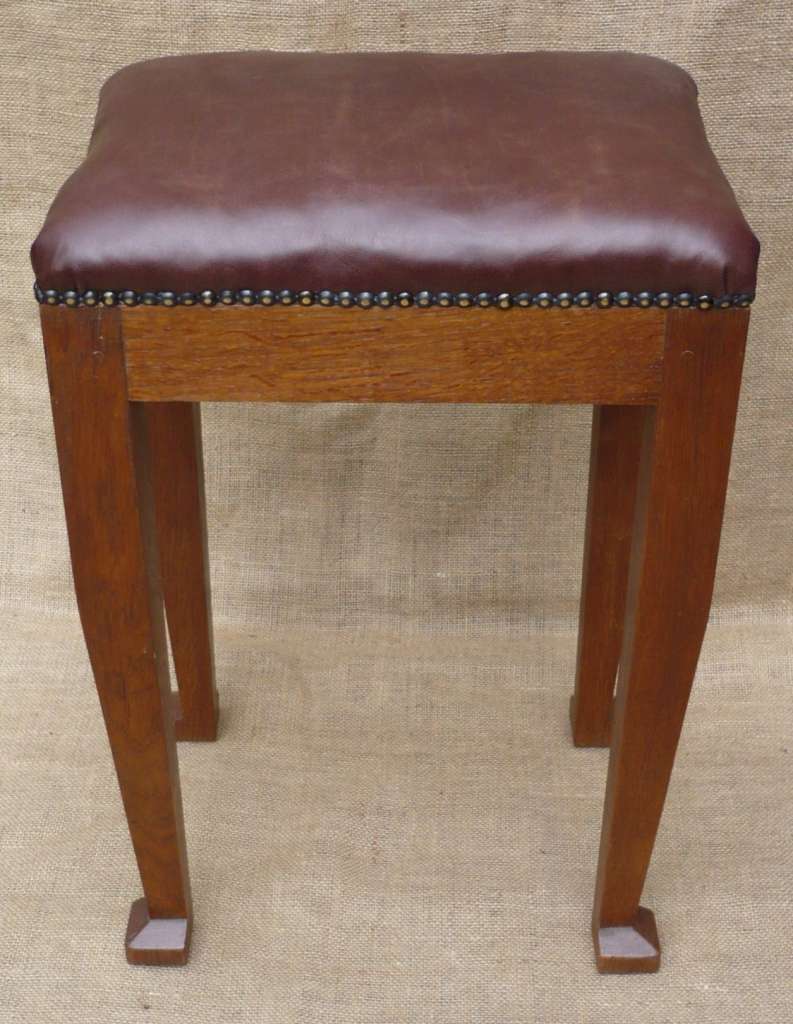 Leather topped stool in oak