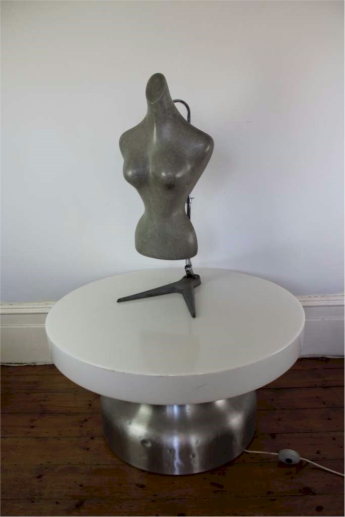 Shop fitting female torso in grey molded plastic