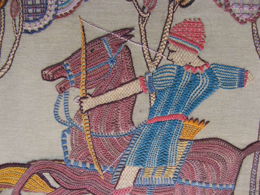 Stylised 1930's embroidery of huntsmen