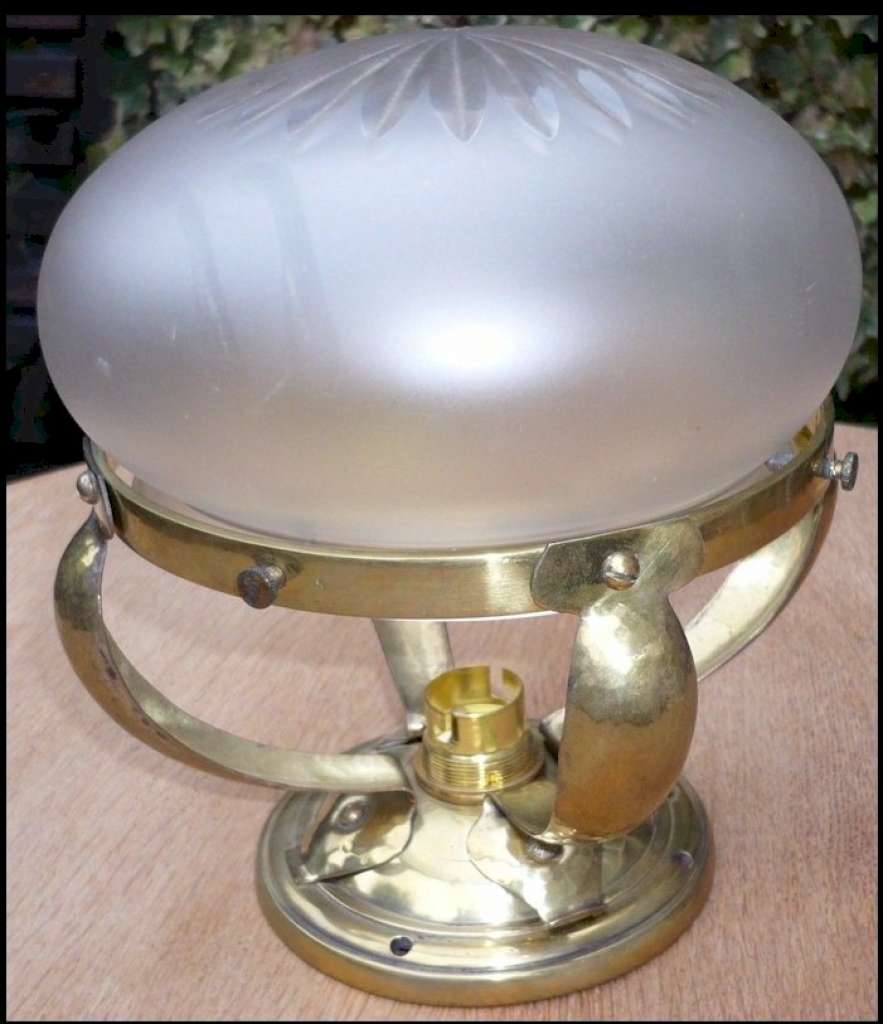 Small domed ceiling light in hammered brass