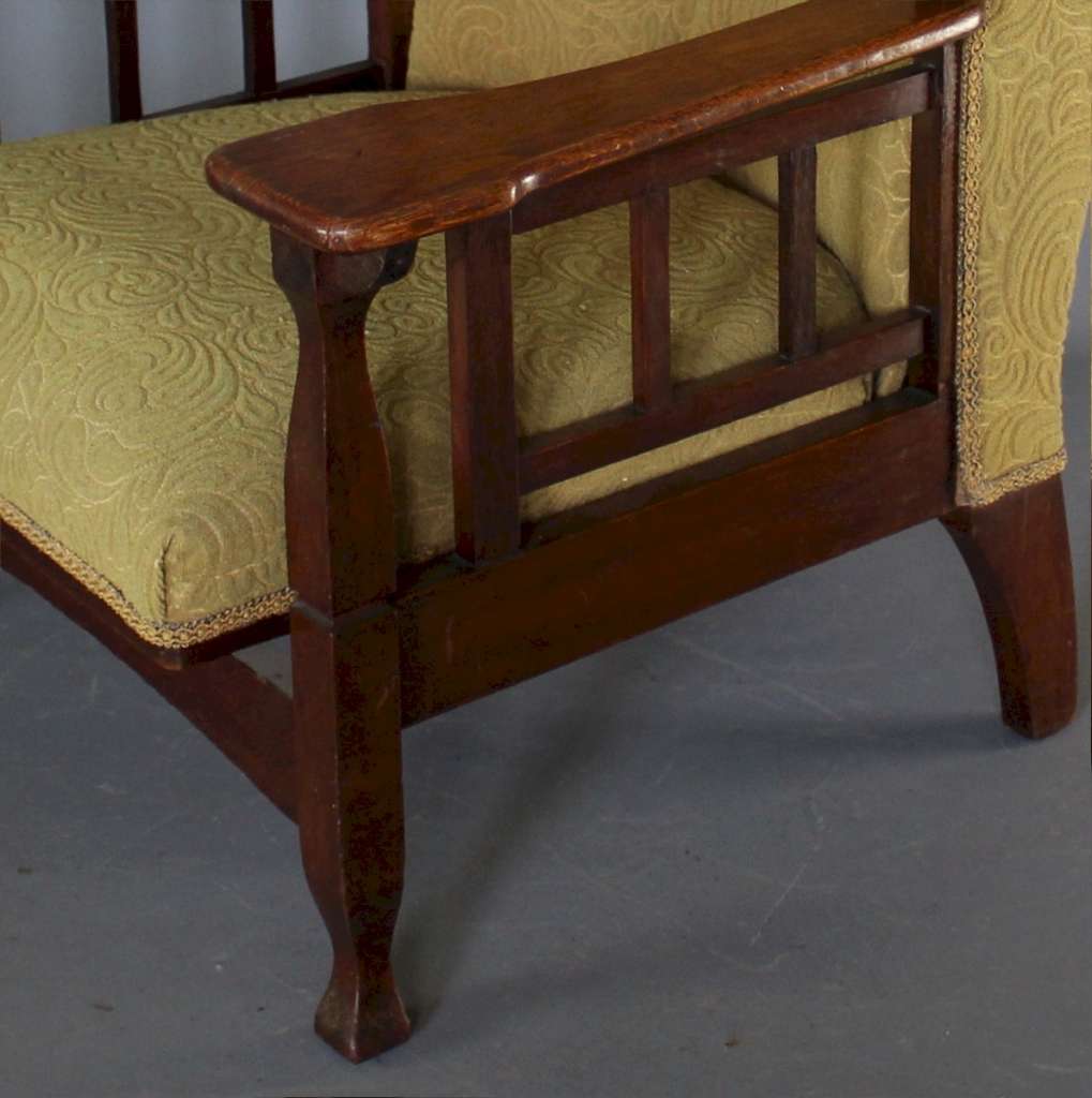Arts and Crafts wing back oak armchair