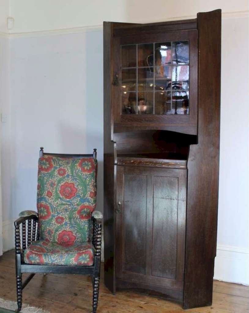 Arts and Crafts oak tall corner display cabinet by Liberty & Co circa 1900