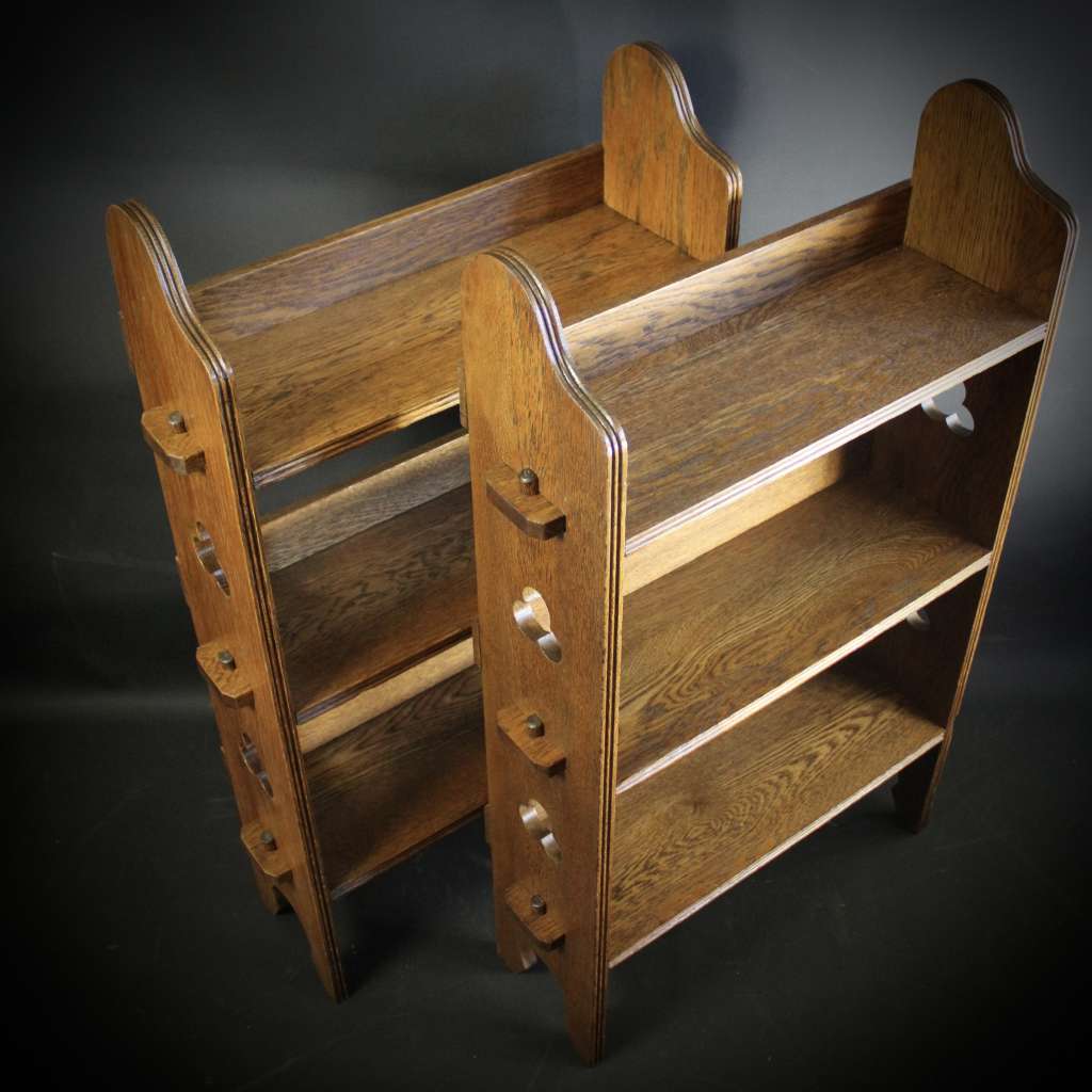 A Pair of Arts and Crafts oak open bookshelves,
