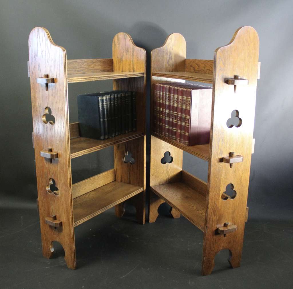 A Pair of Arts and Crafts oak open bookshelves,