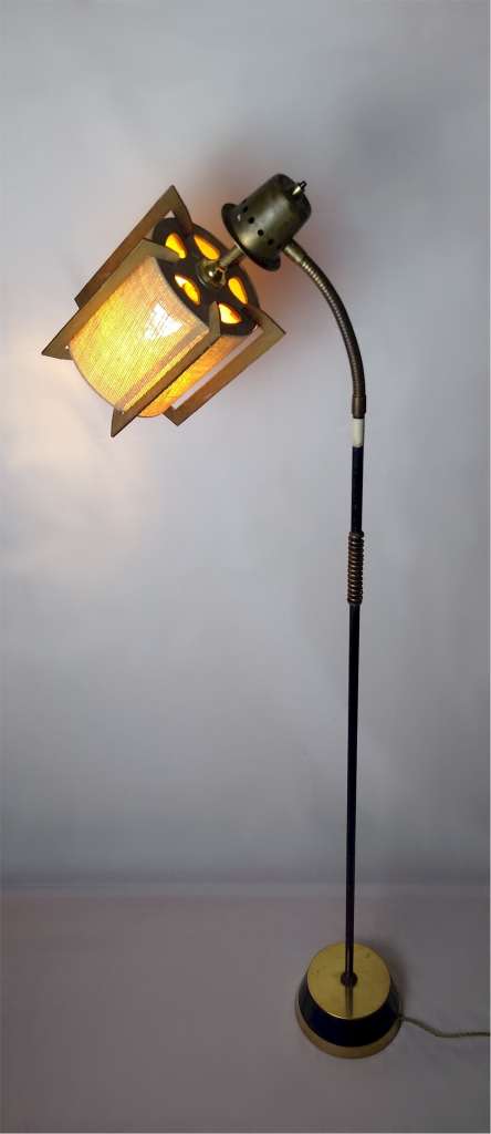 Mid Century floor lamp with adjustable neck .