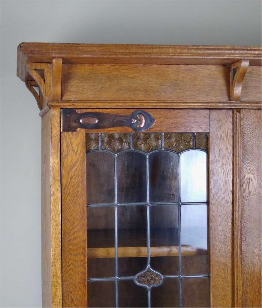 Arts and crafts oak bookcase with strap hinges
