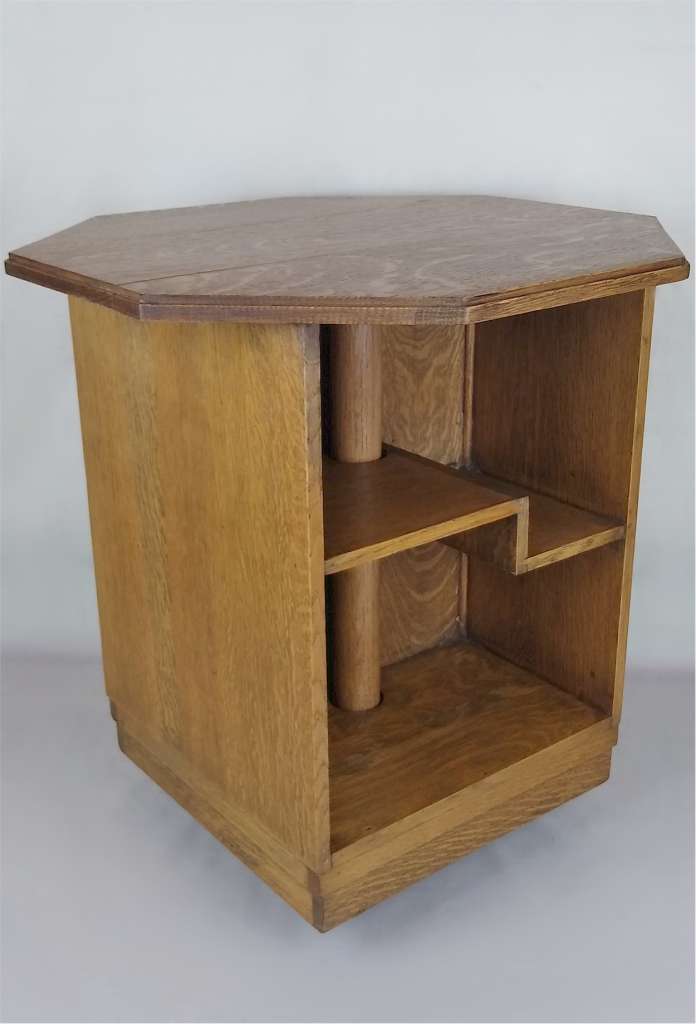 Revolving bookcase table in oak possibly by Heals