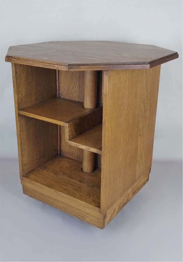 Revolving bookcase table in oak possibly by Heals