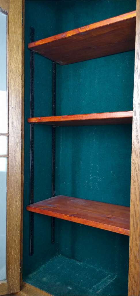 Narrow and tall arts and crafts bookcase in golden oak