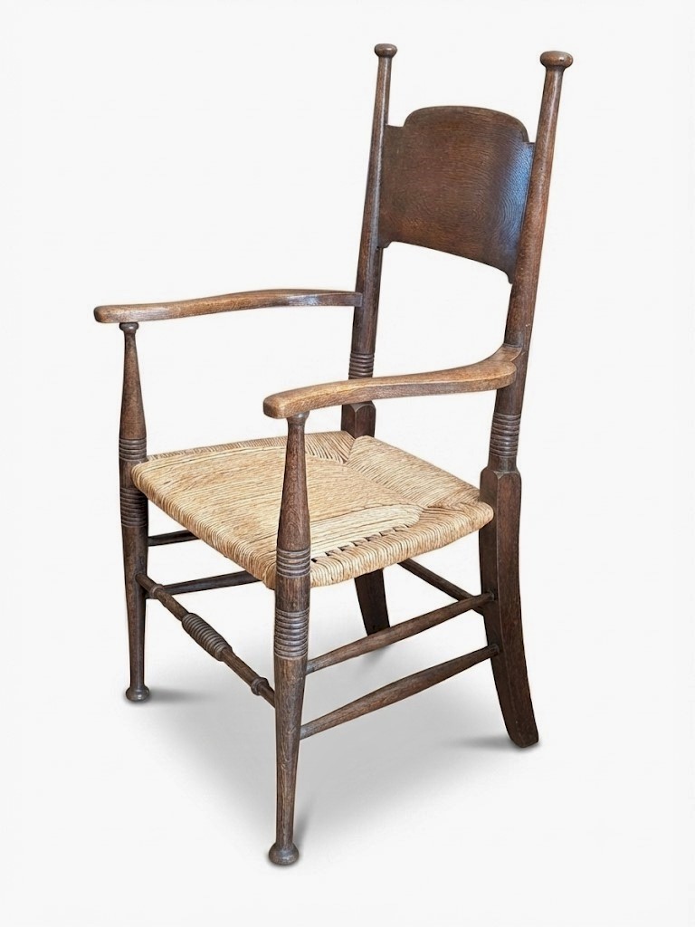 Arts and crafts elbow chair in oak William Birch