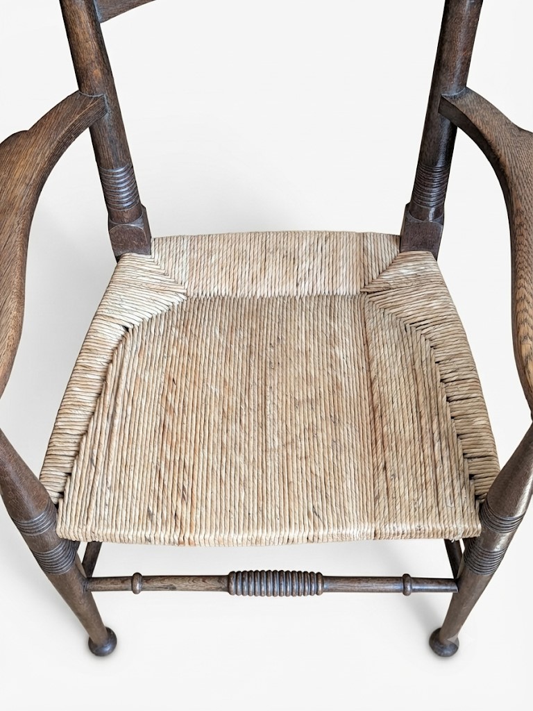 Arts and crafts elbow chair in oak William Birch