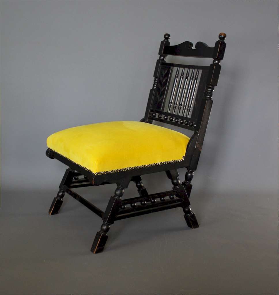 Aesthetic Movement Ebonised fireside chair.