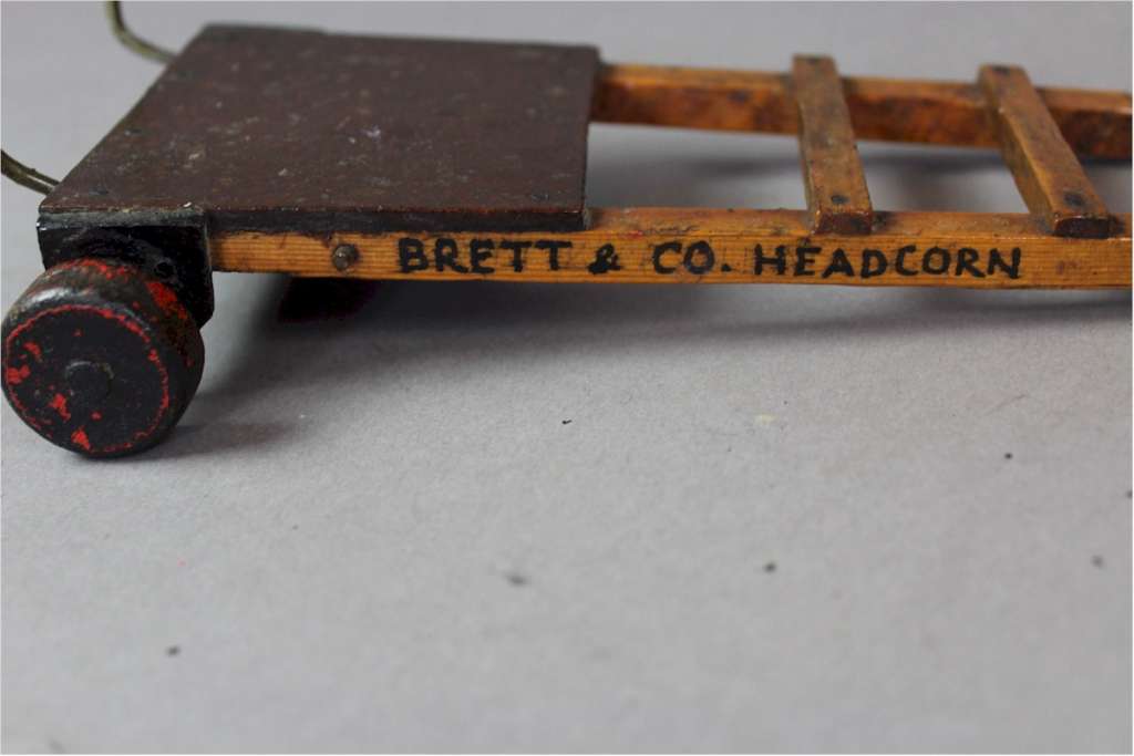 Miniature advertising porters barrow for Brett and Co Headcorn