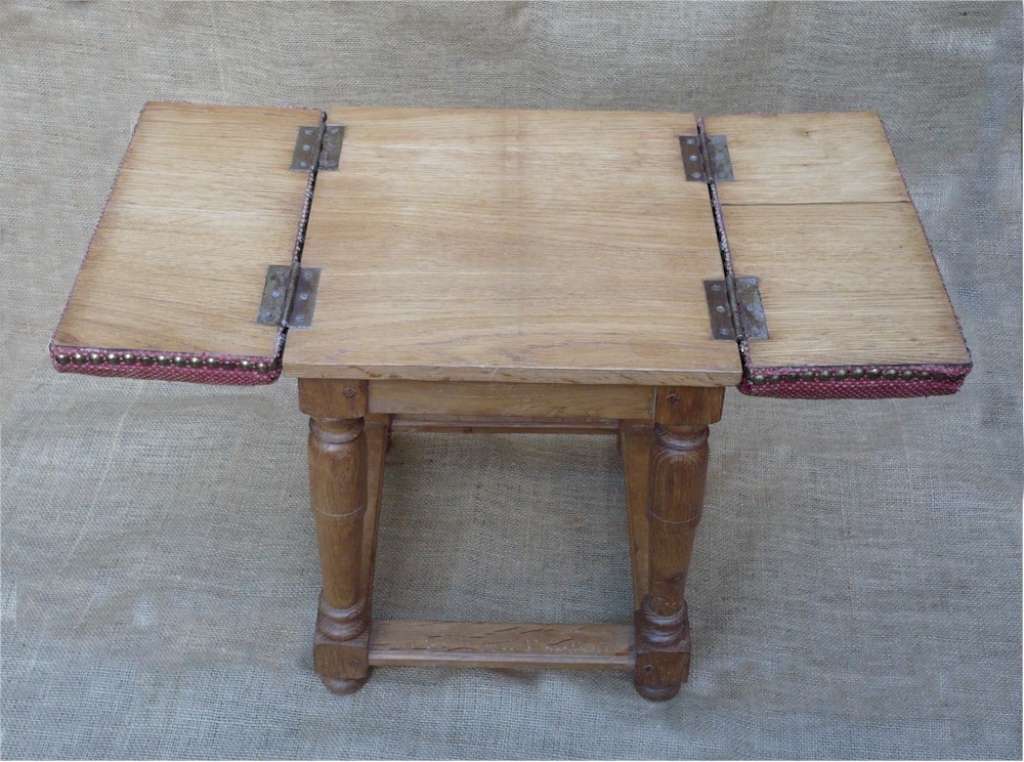 Unusual upholstered stool converts to table