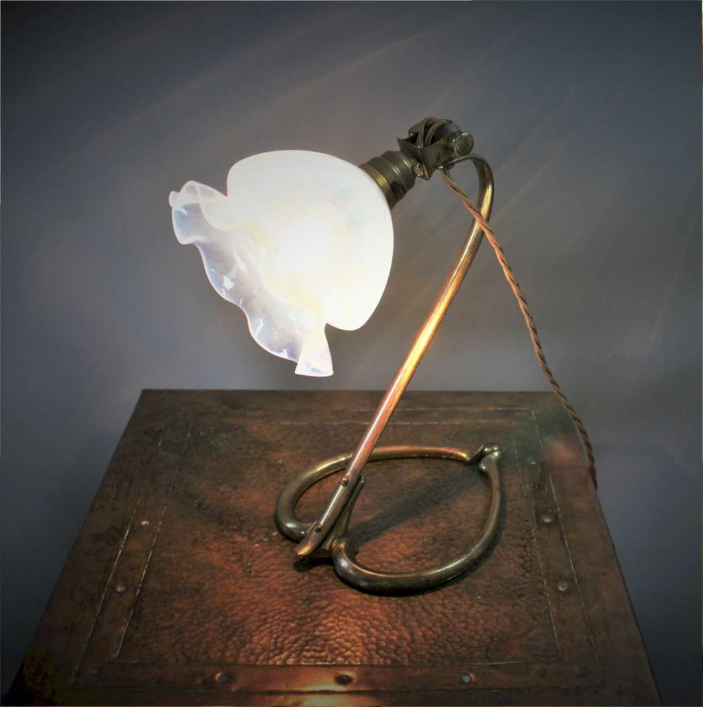 Arts and crafts table lamp in brass , designed by W.A.S Benson
